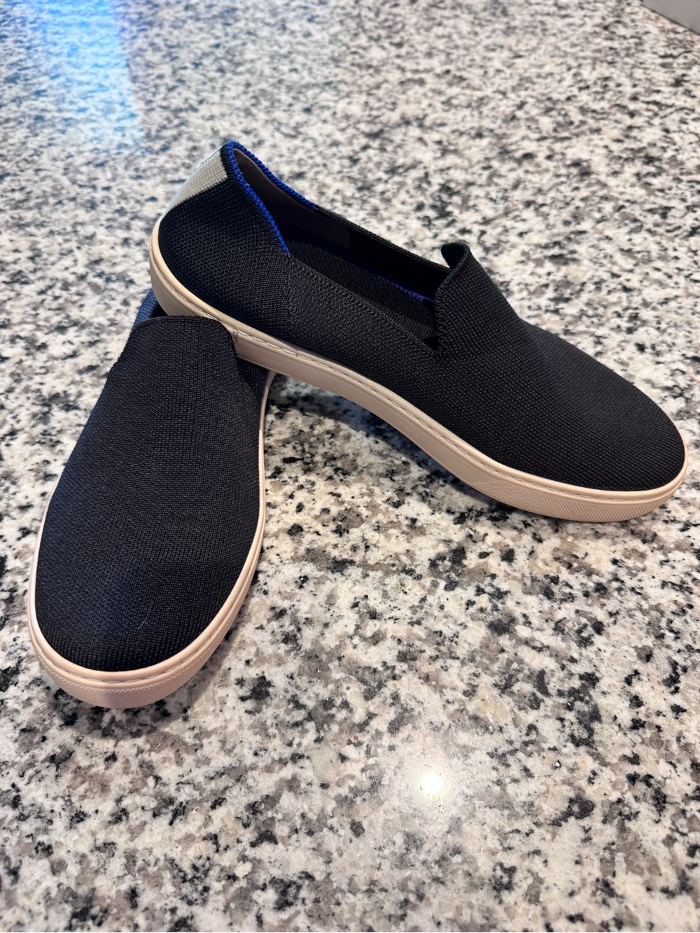 Rothy’s Black Slip-On Knit Sneakers with Light Beige Sole